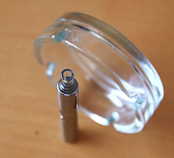 Kanger Evod e-cigarette next to a glass ashtray