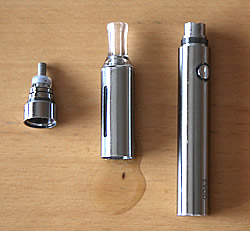 Kanger Evod e-cigarette components: battery, tank and atomiser on a wooden surface