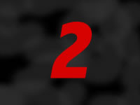 Image of the digit 2 in red on a smokey black background 