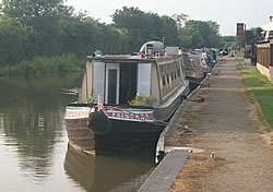Photo of a row of moored canal boats on the Ashby Canal